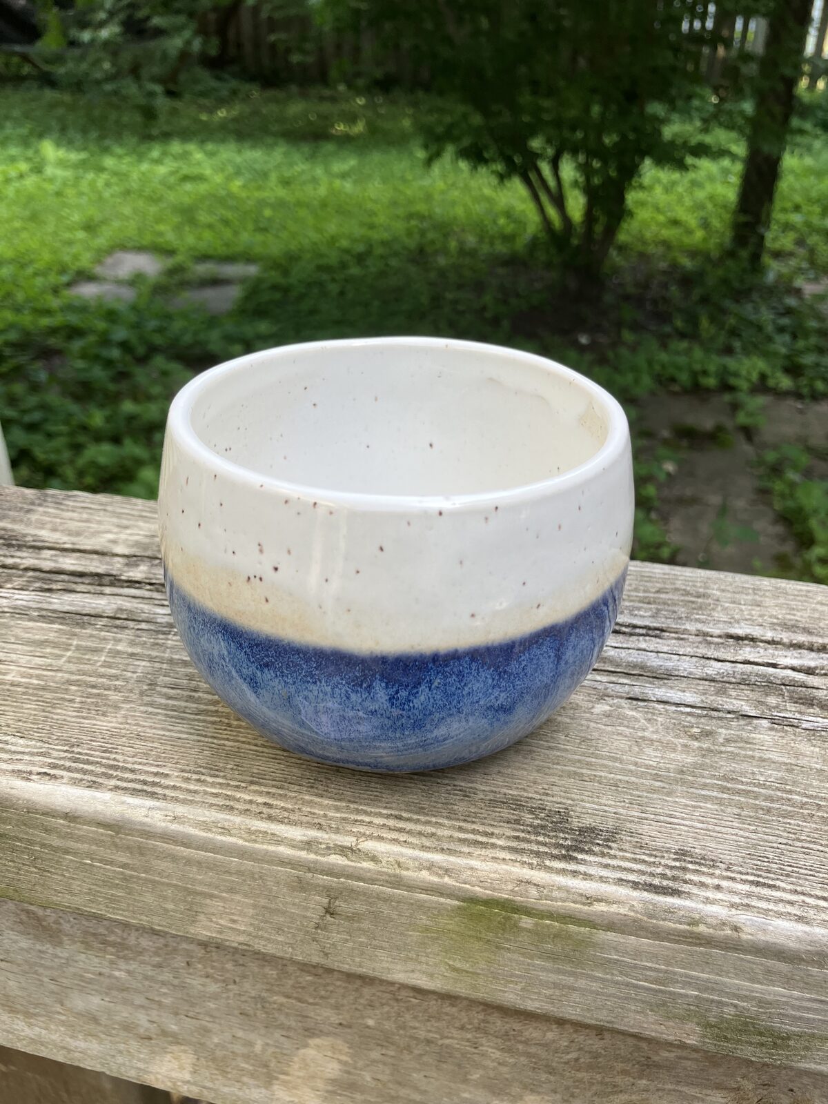 Small white ceramic bowl with cobalt blue base