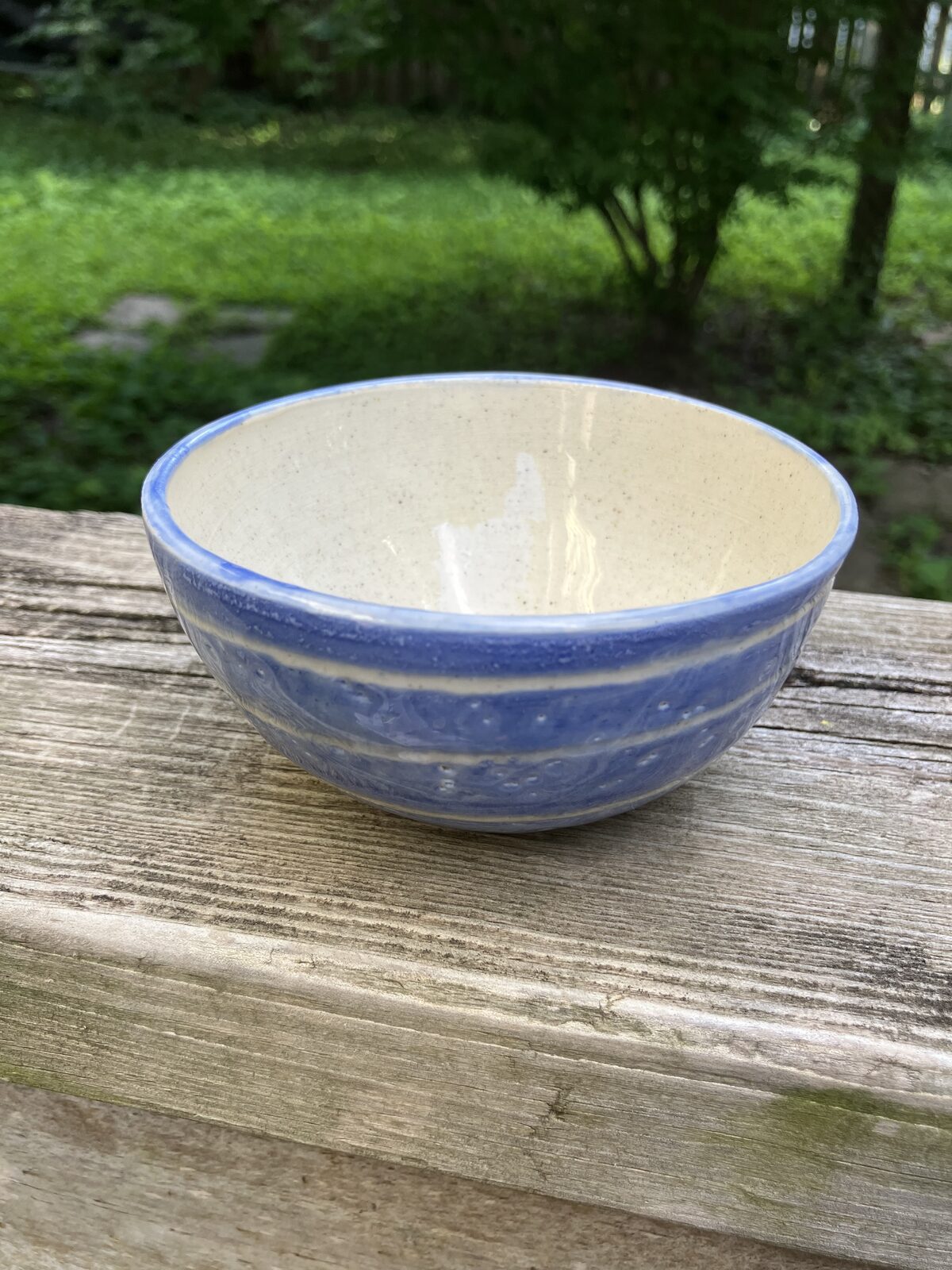 White ceramic bowl with sky blue rim
