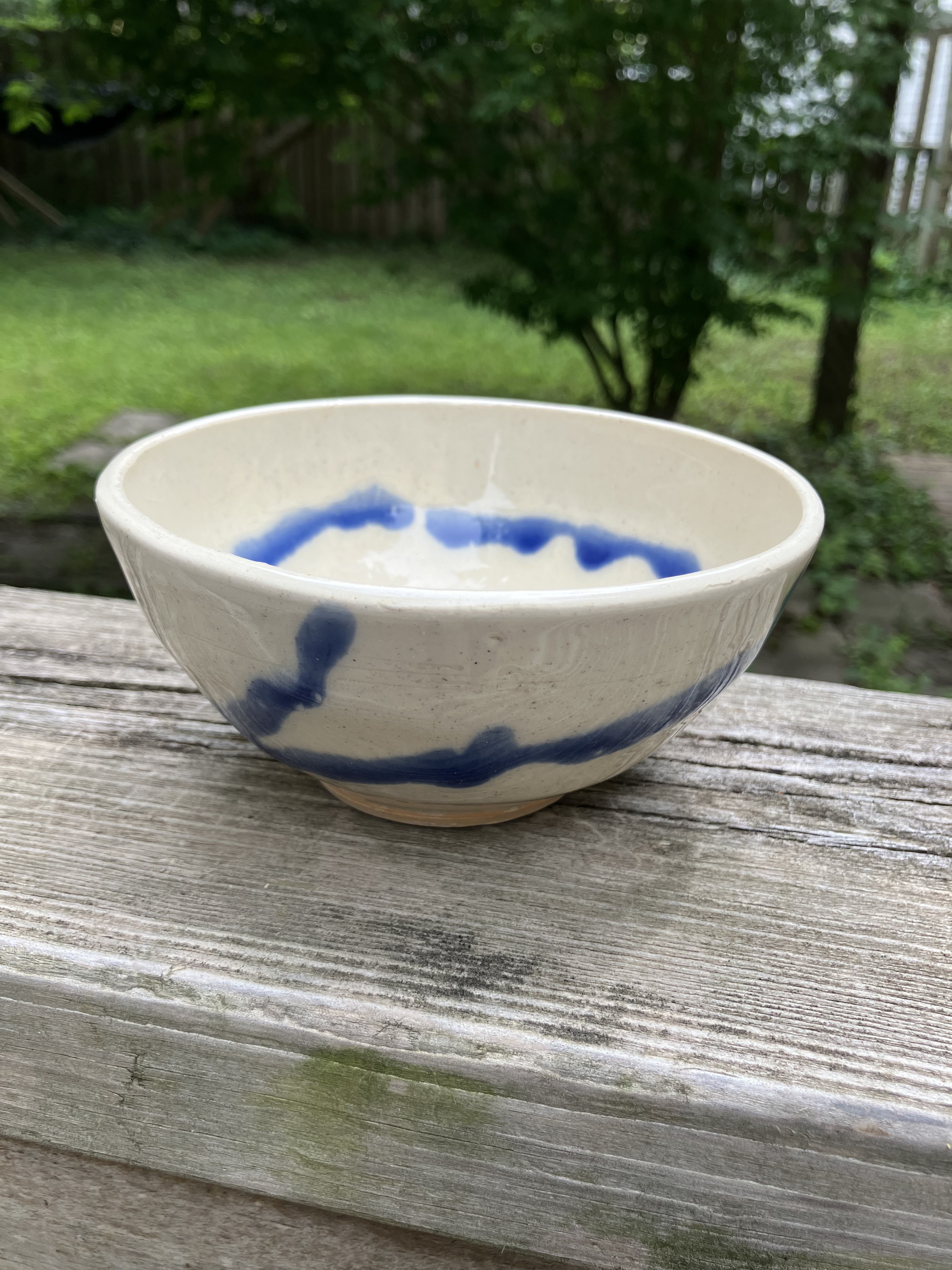 Cream ceramic bowl with speckled tan glaze
