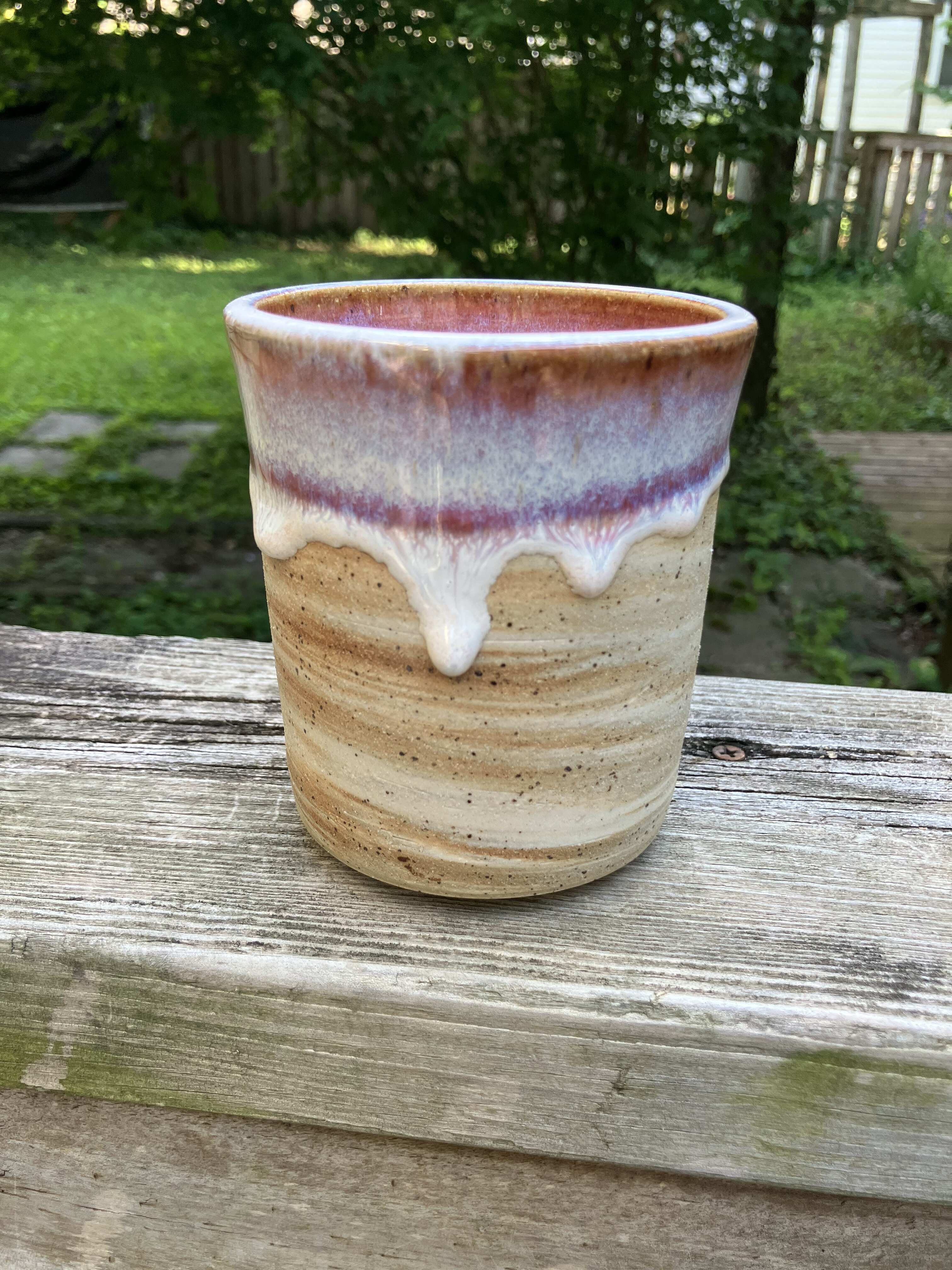 Brown and white swirl cup with pink drippy glaze